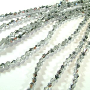 Strand Faceted Bicones 3x3mm Clear with Half Plated Silver Colour